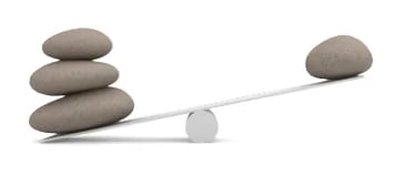 Smooth stones balanced on a seesaw, illustrating pH balance